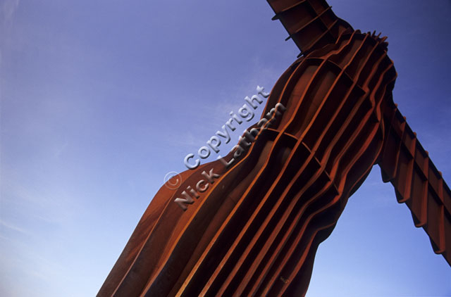 sculpture Tyne and Wear Gateshead Antony Gormley steel rust brown blue sky tall public art landmark famous