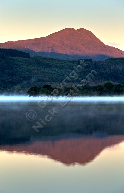 Scotland Trossachs loch water mist reflection lake still calm tranquil outdoor landscape munro mountain hill
