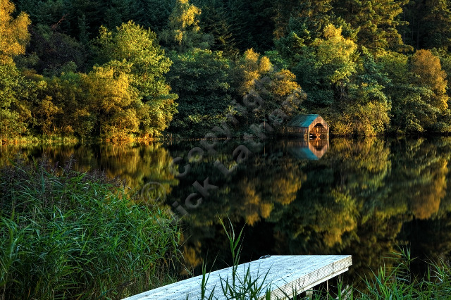 Scotland Trossachs loch lake water reflection jetty landing reed tree wood calm tranquil peaceful HDR