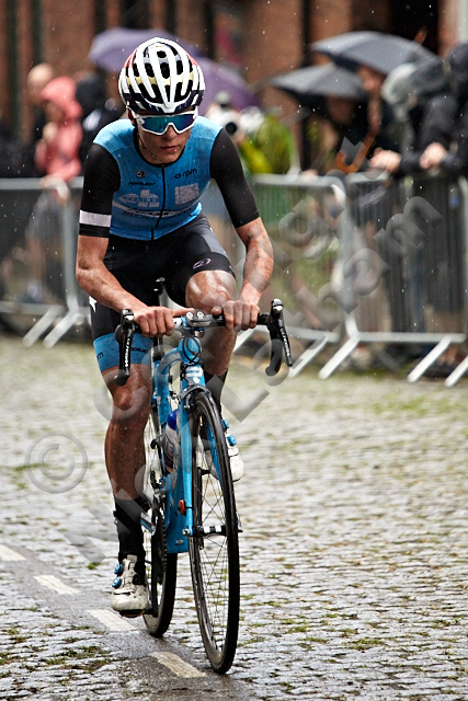 cycling bike hill cobble street steep team competition race winner leader power effort composed controlled spectator